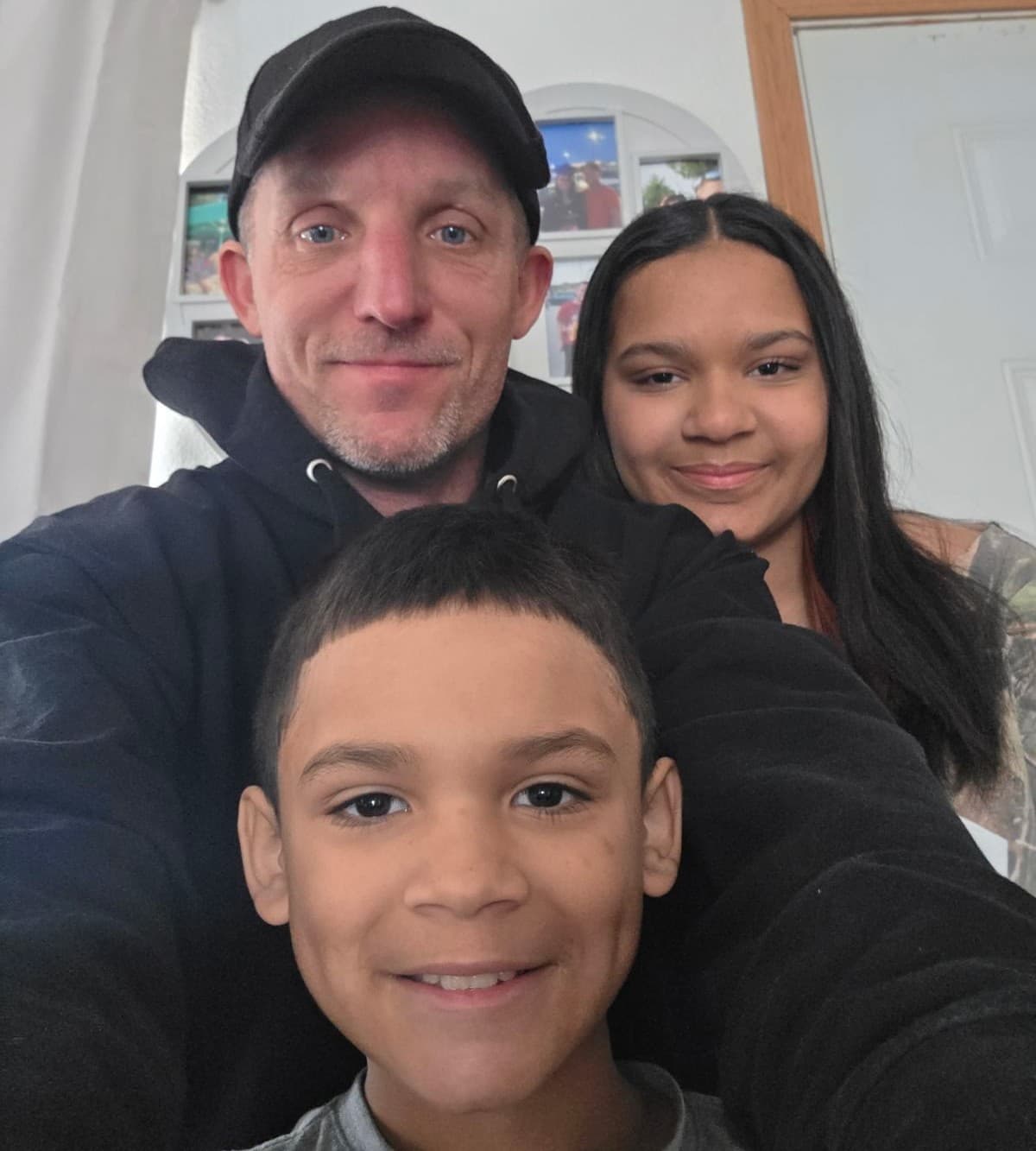 Josh Lewis, owner of Big Dog's Outdoor Services, with his family